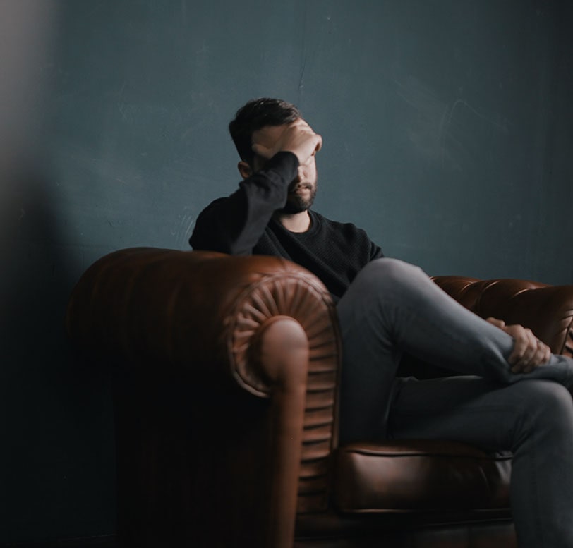 depressed man in chair